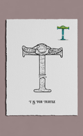 Letter 'T' with turtle design on a white card against a gray background