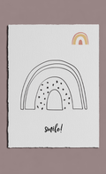 Poster with rainbow designs and 'smile!' text on a plain background