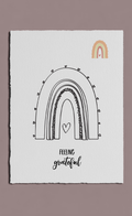 Poster with rainbow design and 'feeling grateful' text on a beige background
