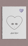 Heart-shaped face illustration with eyes and a mouth on a white background, labeled 'Lonely Heart'.